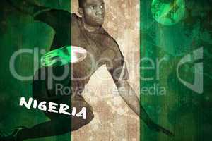 Football player in green kicking