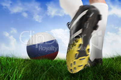 Football boot kicking russia ball