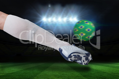 Close up of football player kicking brasil ball