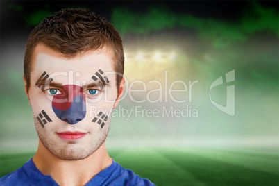 South korea football fan in face paint