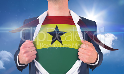 Businessman opening shirt to reveal ghana flag