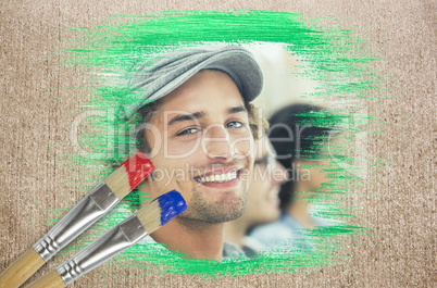 Composite image of smiling designer