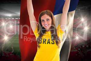 Pretty football fan in brasil t-shirt holding chile flag