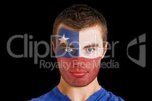 Serious young chile fan with facepaint