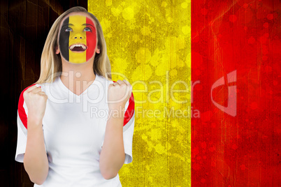 Excited belgium fan in face paint cheering