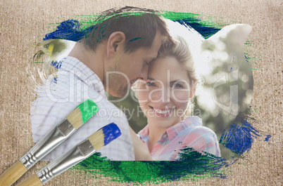 Composite image of happy couple in the countryside