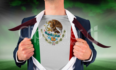 Businessman opening shirt to reveal mexico flag