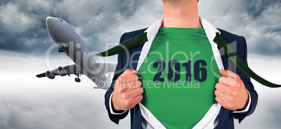 Composite image of businessman opening shirt in superhero style