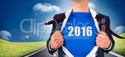 Composite image of businessman opening his shirt superhero style