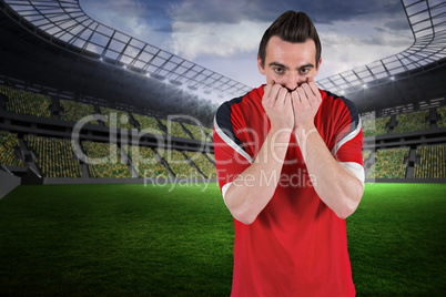 Nervous football fan looking ahead