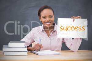 Happy teacher holding page showing success