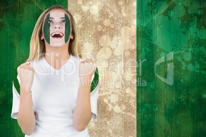 Excited nigeria fan in face paint cheering