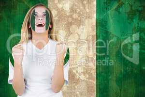 Excited nigeria fan in face paint cheering