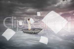 Composite image of thinking businesswoman in a boat