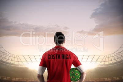 Costa rica football player holding ball