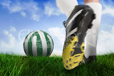Football boot kicking nigeria ball
