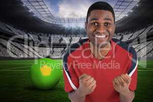 Excited handsome football fan cheering