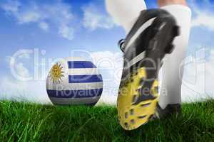 Football boot kicking uruguay ball