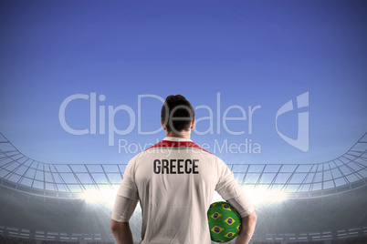 Greece football player holding ball