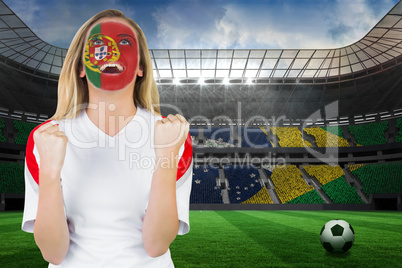 Excited portugal fan in face paint cheering