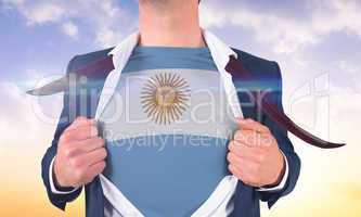 Businessman opening shirt to reveal argentina flag