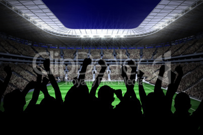 Silhouettes of football supporters