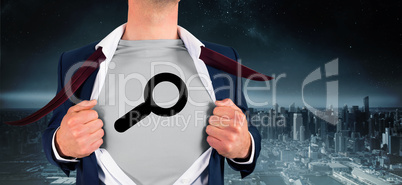 Composite image of businessman opening shirt in superhero style