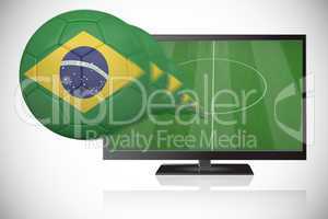 Football in brasil colours flying out of tv