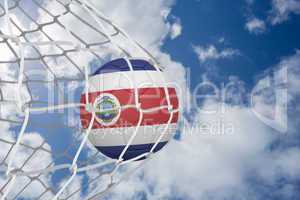 Football in costa rica colours at back of net