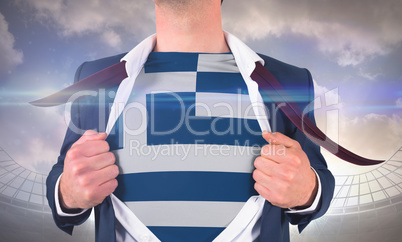 Businessman opening shirt to reveal greece flag