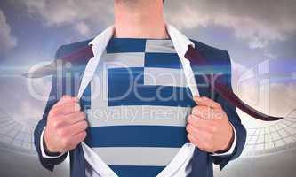 Businessman opening shirt to reveal greece flag
