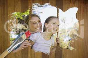 Composite image of mother and daughter in the park