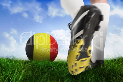 Football boot kicking belgium ball