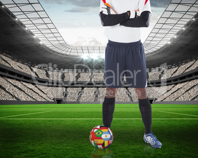 Goalkeeper standing with international ball