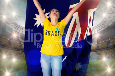 Excited football fan in brasil tshirt holding australia flag