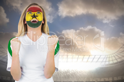 Excited ghana fan in face paint cheering