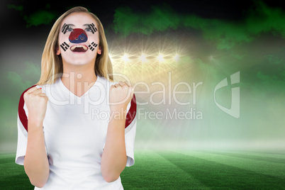 Excited south korea fan in face paint cheering