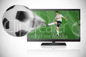 Football player in white kicking ball out of tv