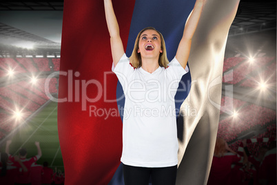 Cheering football fan in white holding russia flag