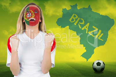 Excited portugal fan in face paint cheering