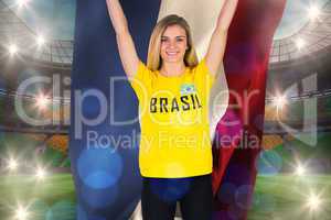 Excited football fan in brasil tshirt holding netherlands flag