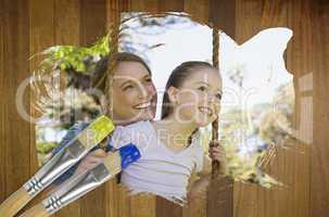 Composite image of mother and daughter in the park