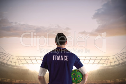 France football player holding ball