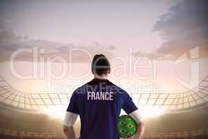 France football player holding ball