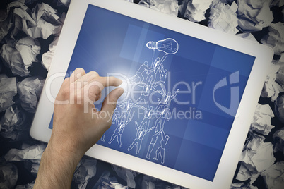 Composite image of hand touching tablet