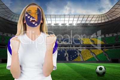 Excited bosnia fan in face paint cheering
