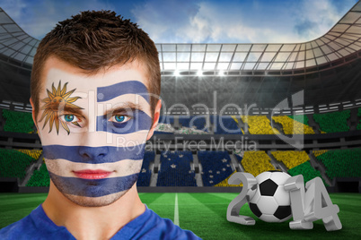 Serious young uruguay fan with facepaint