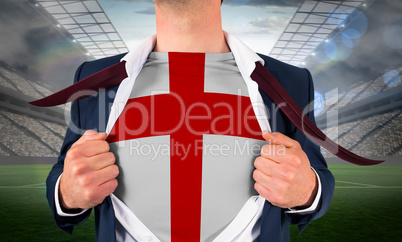 Businessman opening shirt to reveal england flag