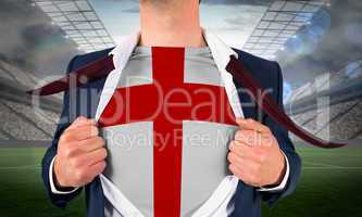 Businessman opening shirt to reveal england flag