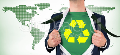 Composite image of businessman opening shirt in superhero style